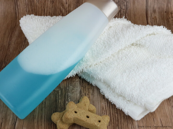 DIY Dog Shampoo in a bottle on a towel