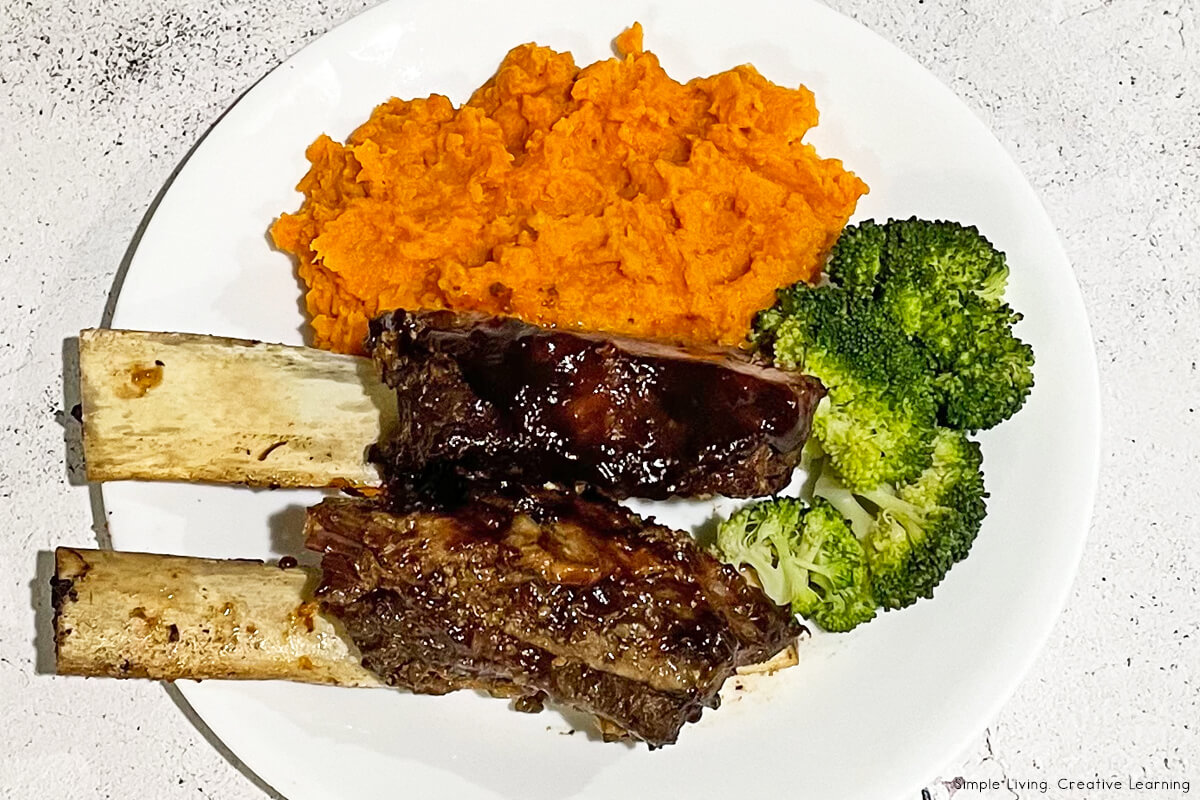 Instant Pot Ribs on a plate with mash and broccoli