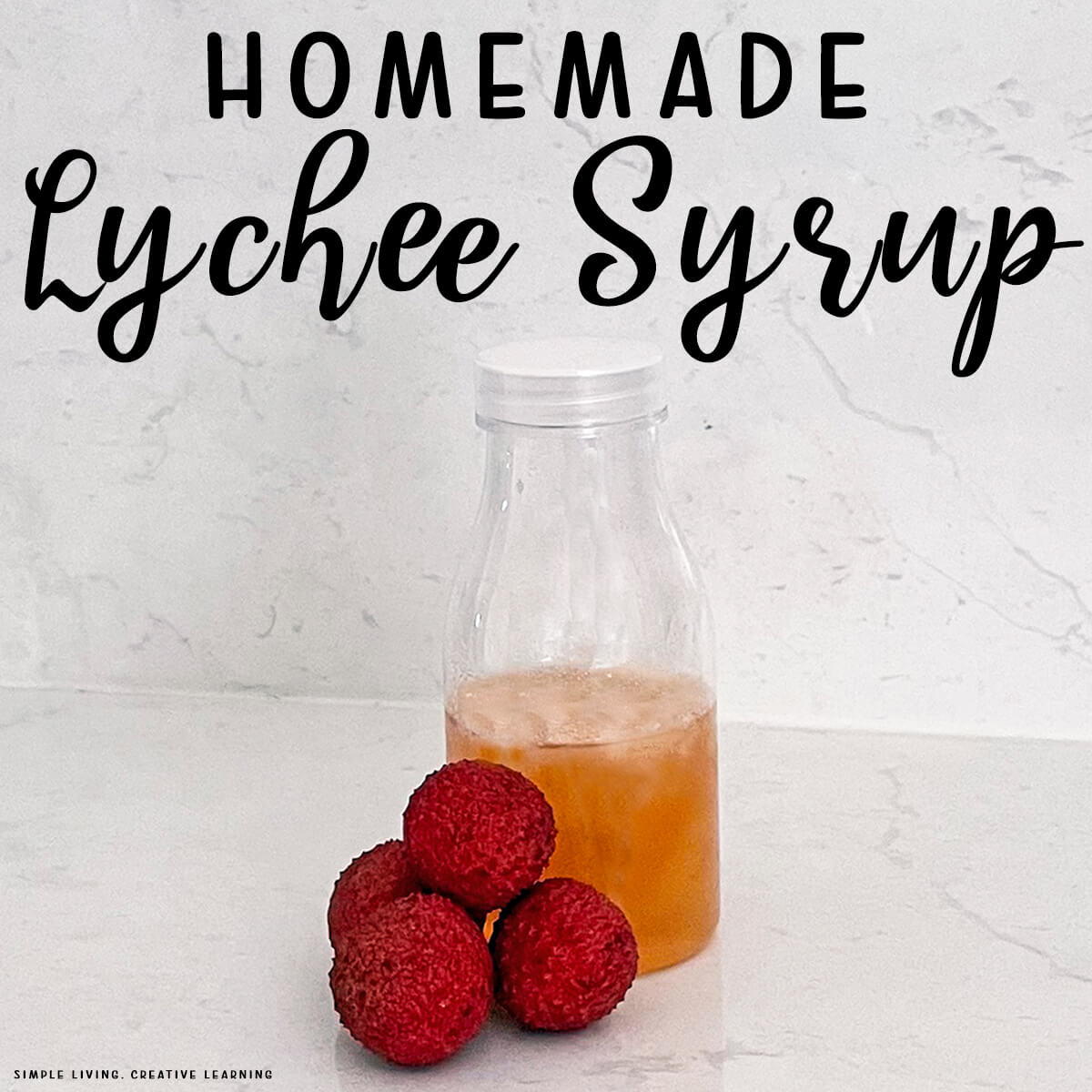 Homemade Lychee Syrup in a bottle with four lychees
