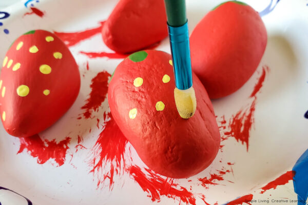How to Make Strawberry Rocks - Painting on the yellow seeds
