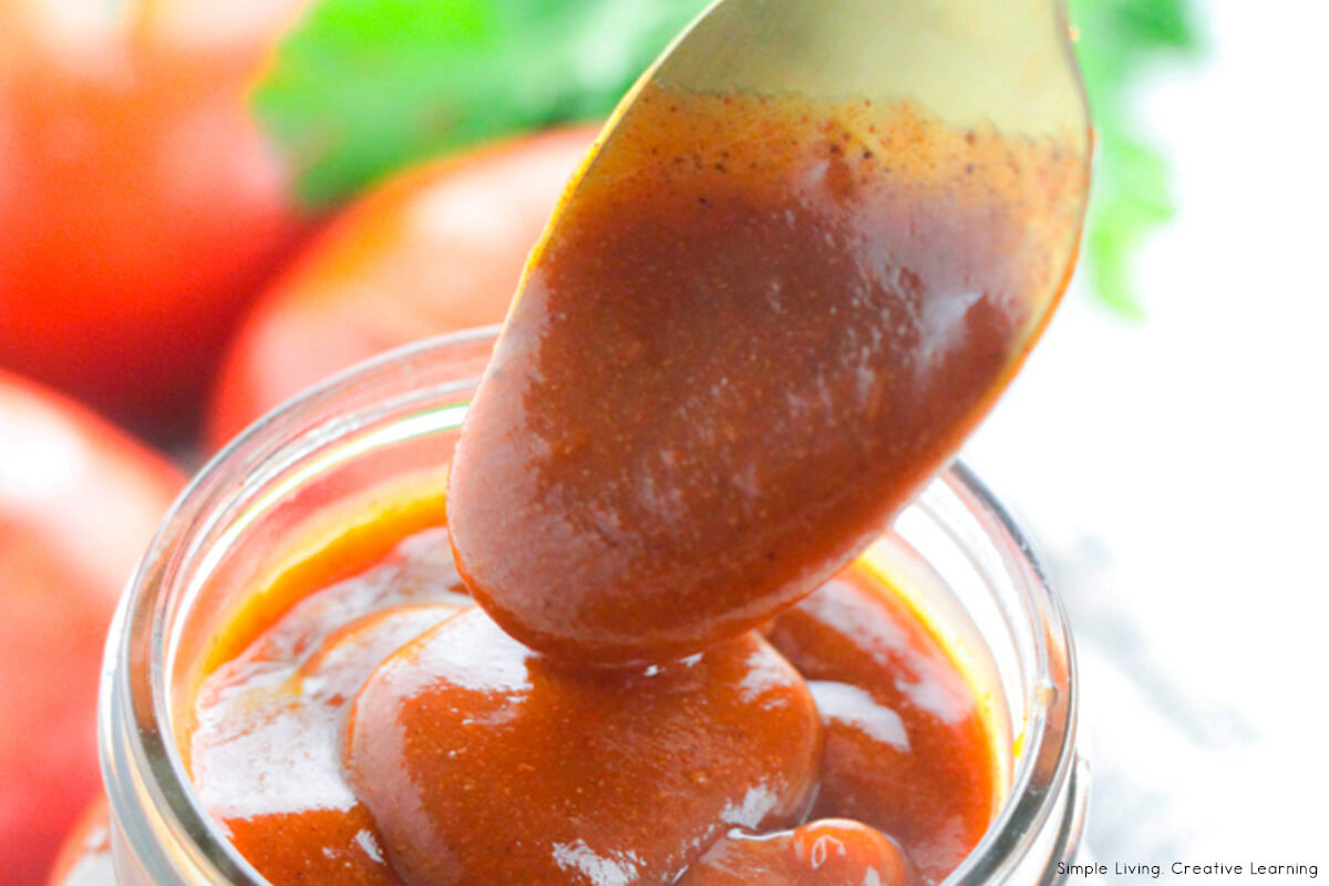 Homemade Enchilada Sauce Recipe on a spoon