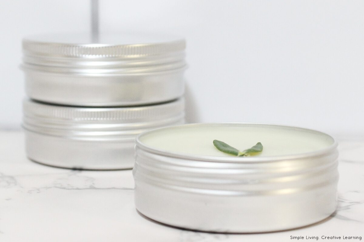 Rosemary Salve in the front and two containers at the back
