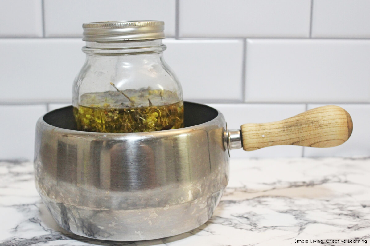 Herbal Muscle Salve - making the infused oil using a double boiler to heat
