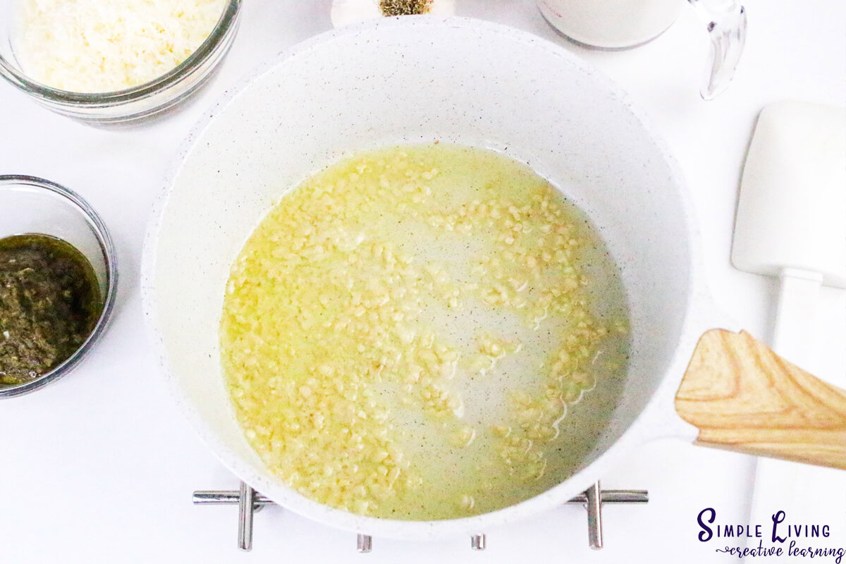 Homemade Alfredo Pesto Sauce cooking the garlic