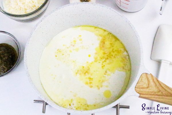 Homemade Alfredo Pesto Sauce stirring through the cream