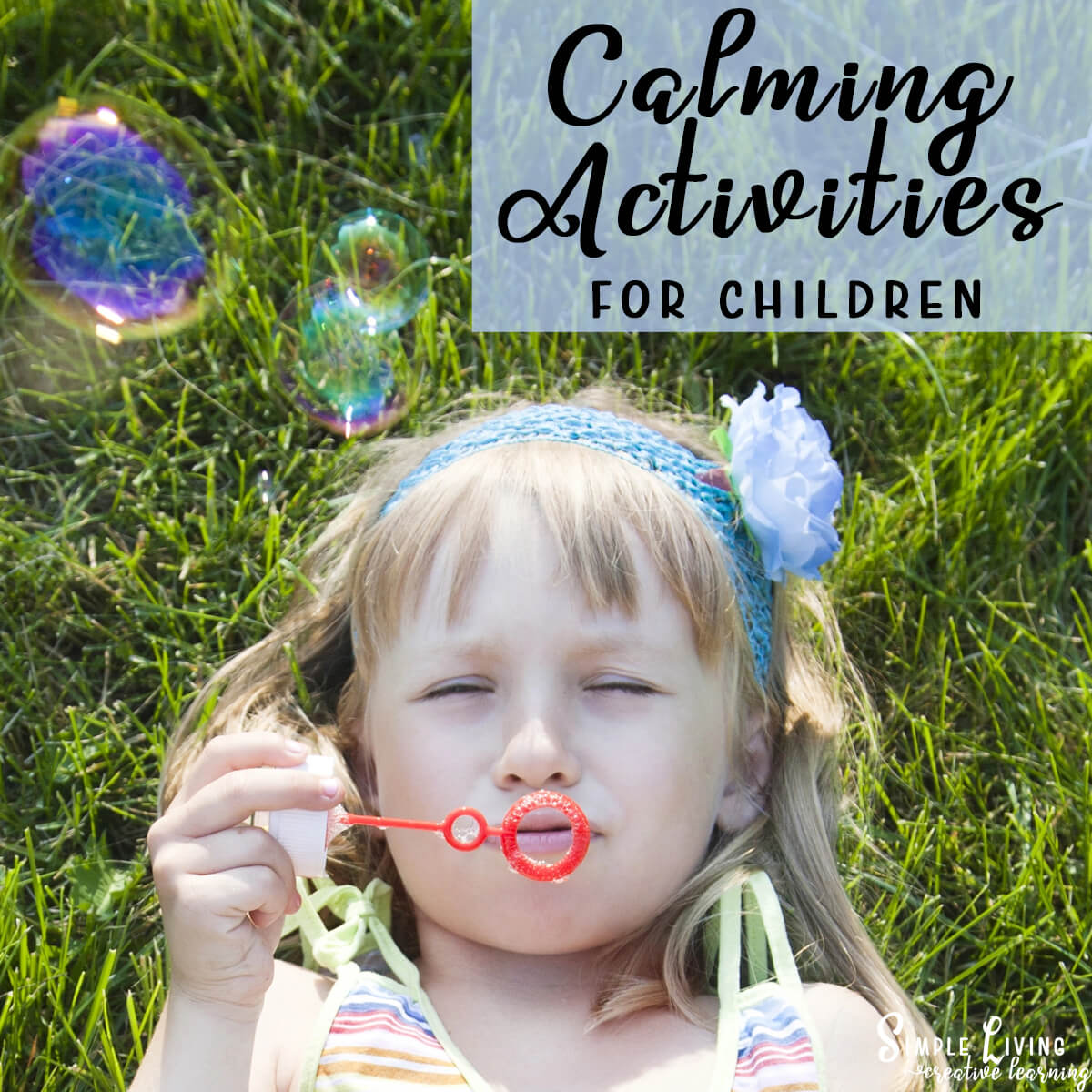 Calming Activities For Children a girl laying on grass blowing bubbles