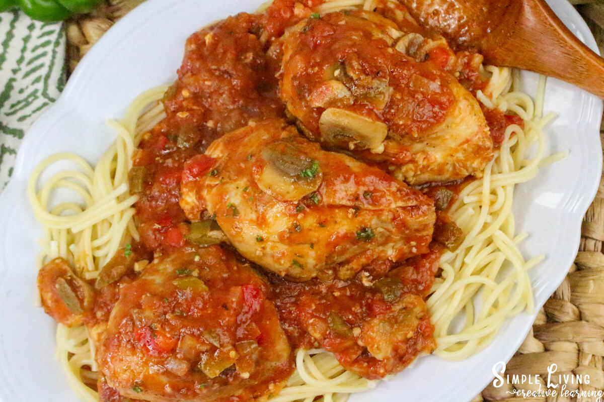 Dutch Oven Chicken Cacciatore on a white plate ready to eat