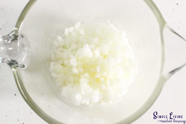 Beeswax Lip Balm putting ingredients in a microwavable safe jug