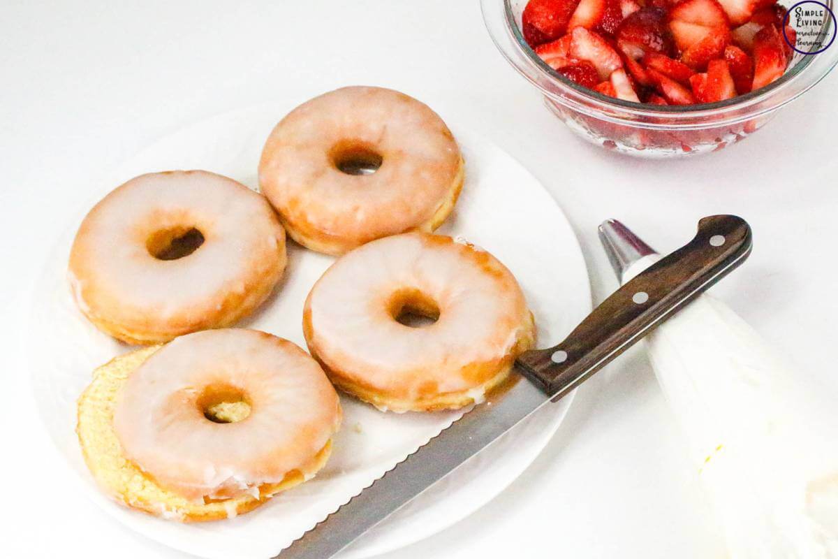 Easy Strawberry Shortcake Donuts slicing the donuts