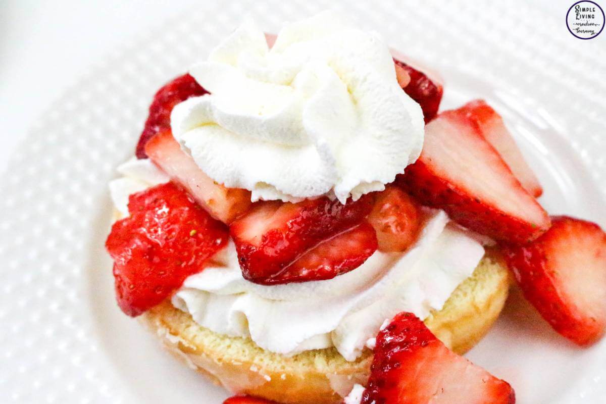 Easy Strawberry Shortcake Donuts adding the strawberries and more cream
