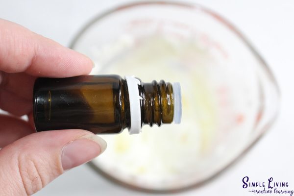 Homemade Tallow Sugar Scrub adding essential oils