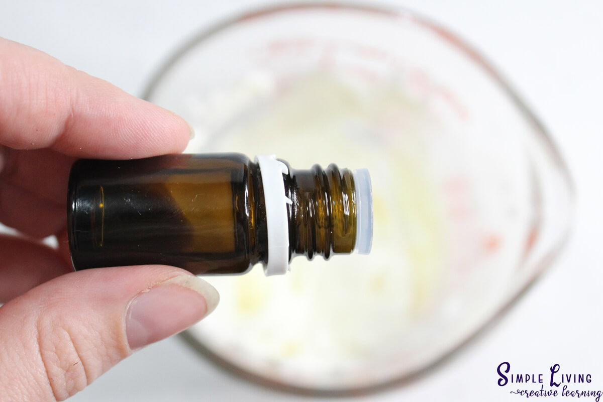 Homemade Tallow Sugar Scrub adding essential oils