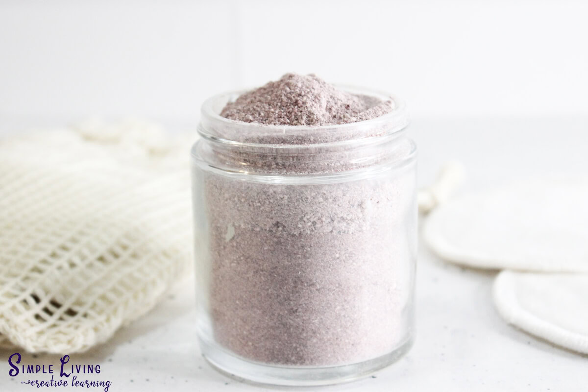 Hibiscus Cleansing Grains in a glass jar with a cloth in the background