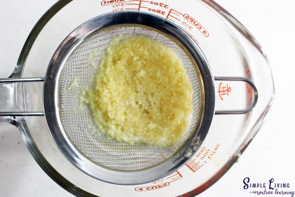 Immunity Shots With Lemon, Ginger and Turmeric straining