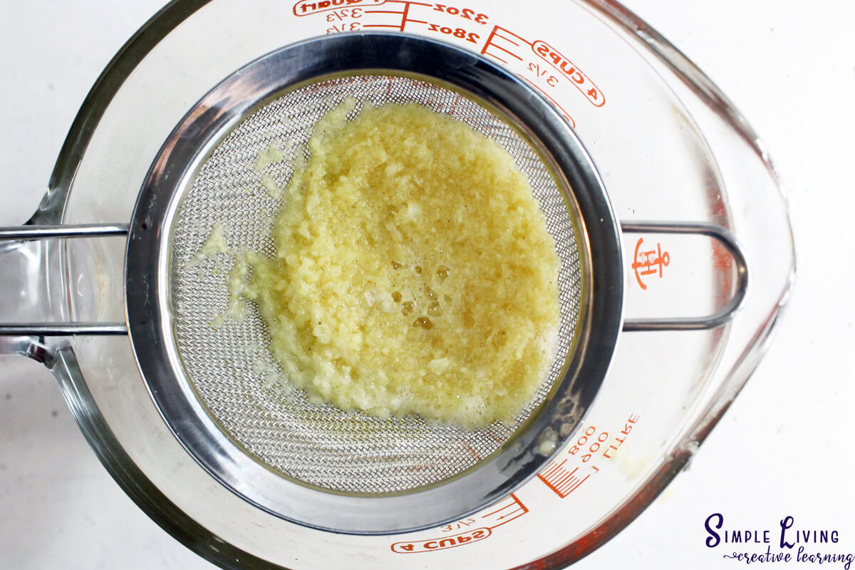 Immunity Shots With Lemon, Ginger and Turmeric straining