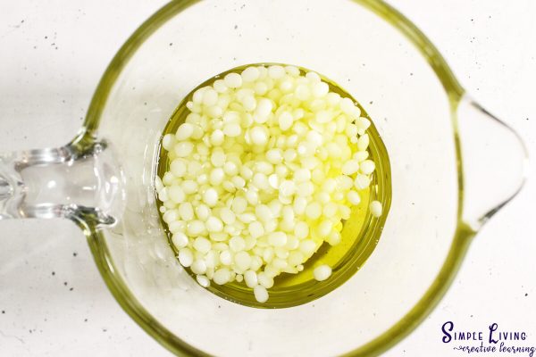 Herbal Antibiotic Ointment melting beeswax and infused oil together