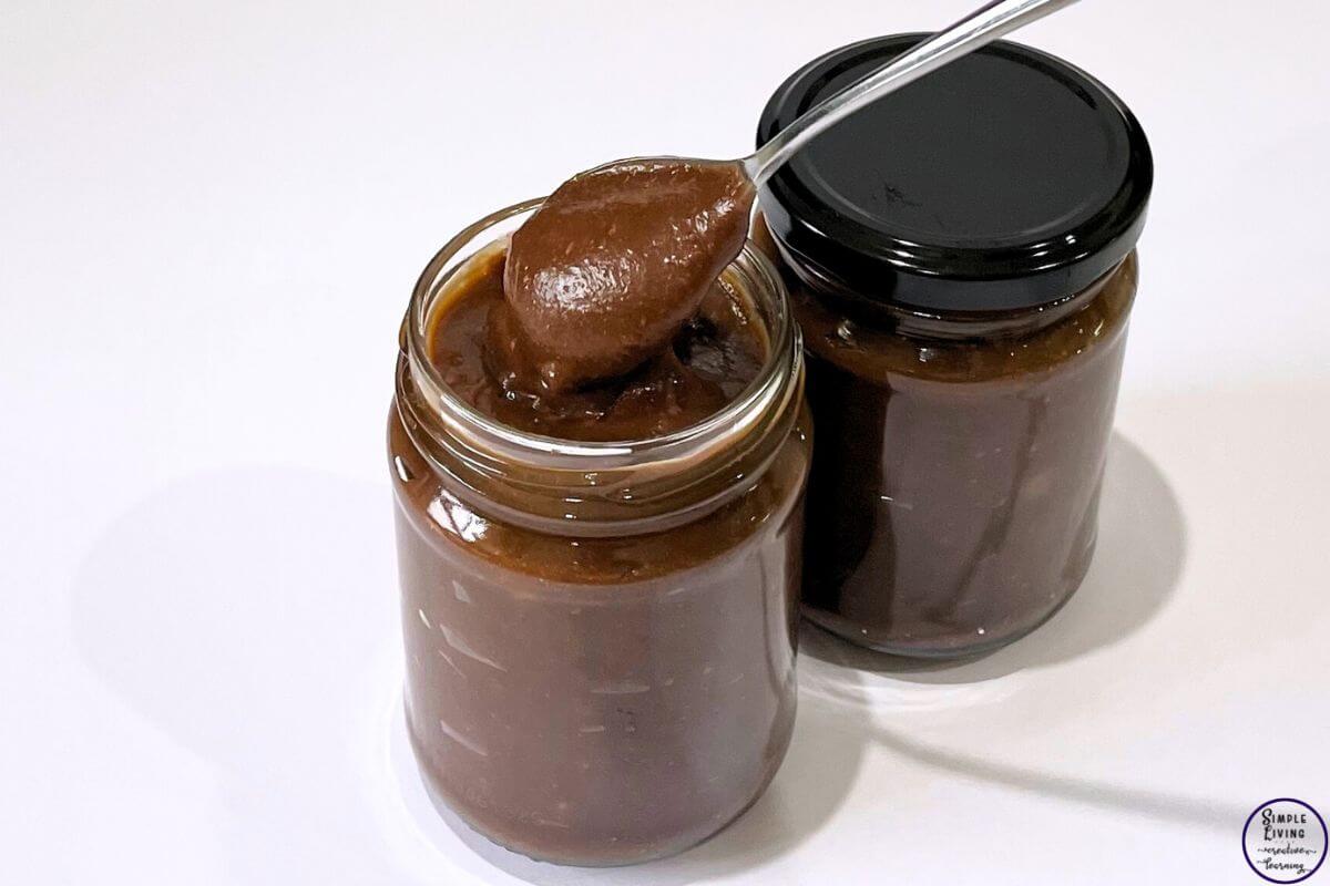 Tim Tam Spread with a spoon picking up some spread