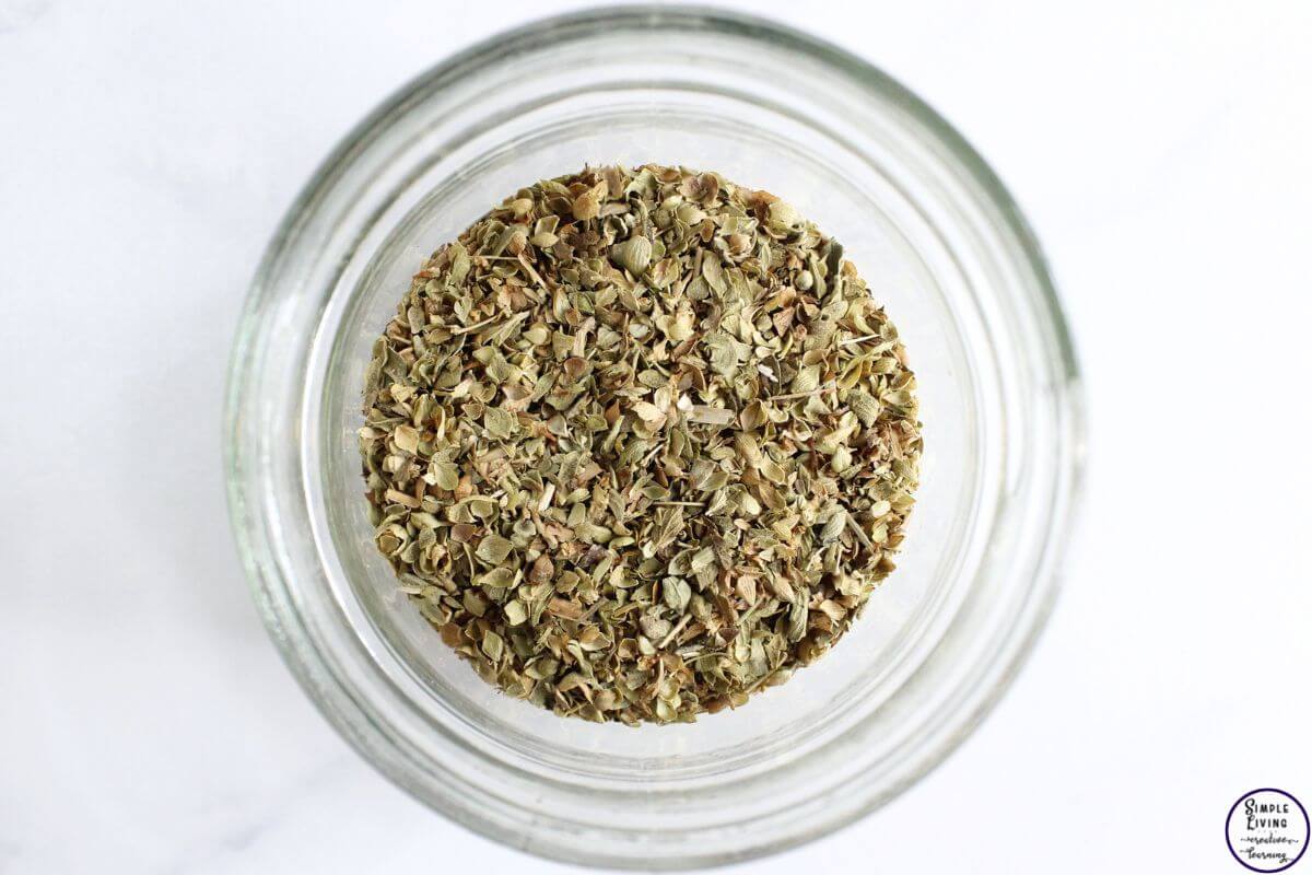 Homemade Oregano Infused Oil dried leaves in a jar