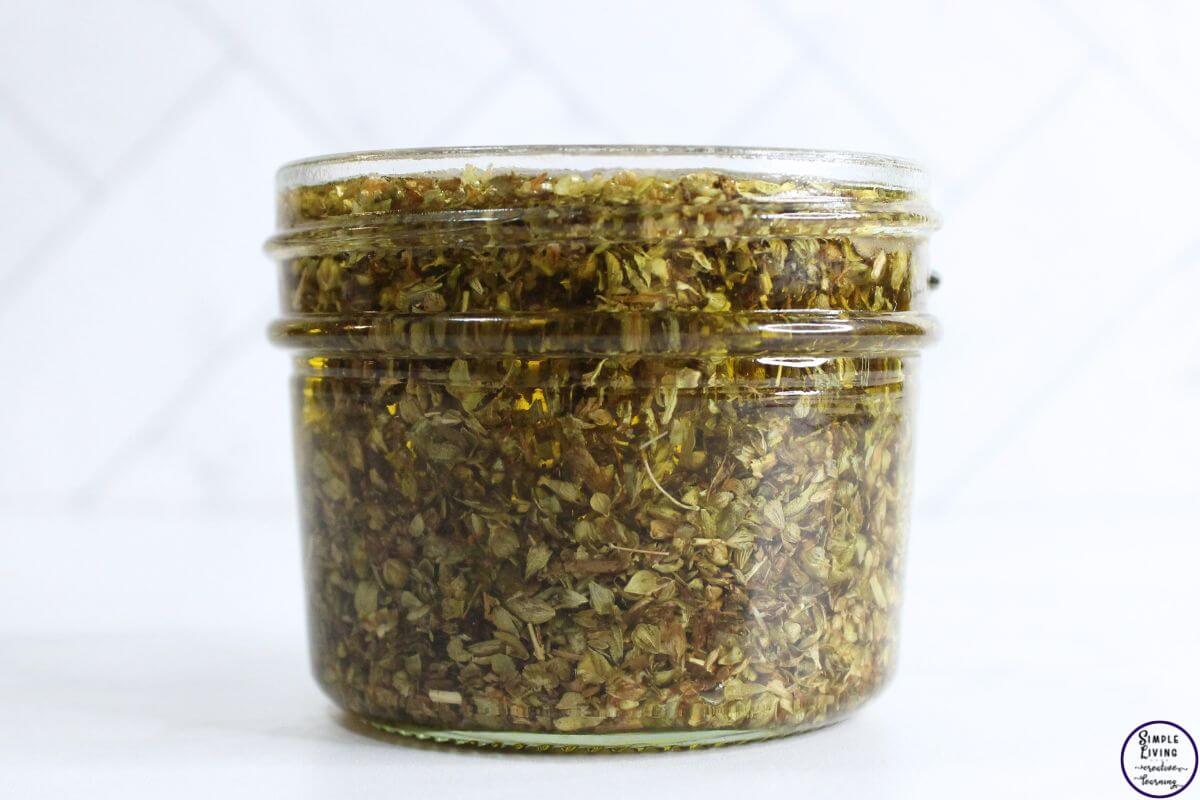 Homemade Oregano Infused Oil ready to add lid and rest to infuse