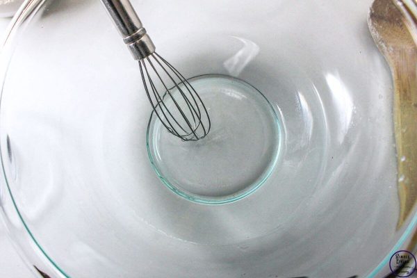 No-Knead Dutch Oven Bread mixing water and sugar