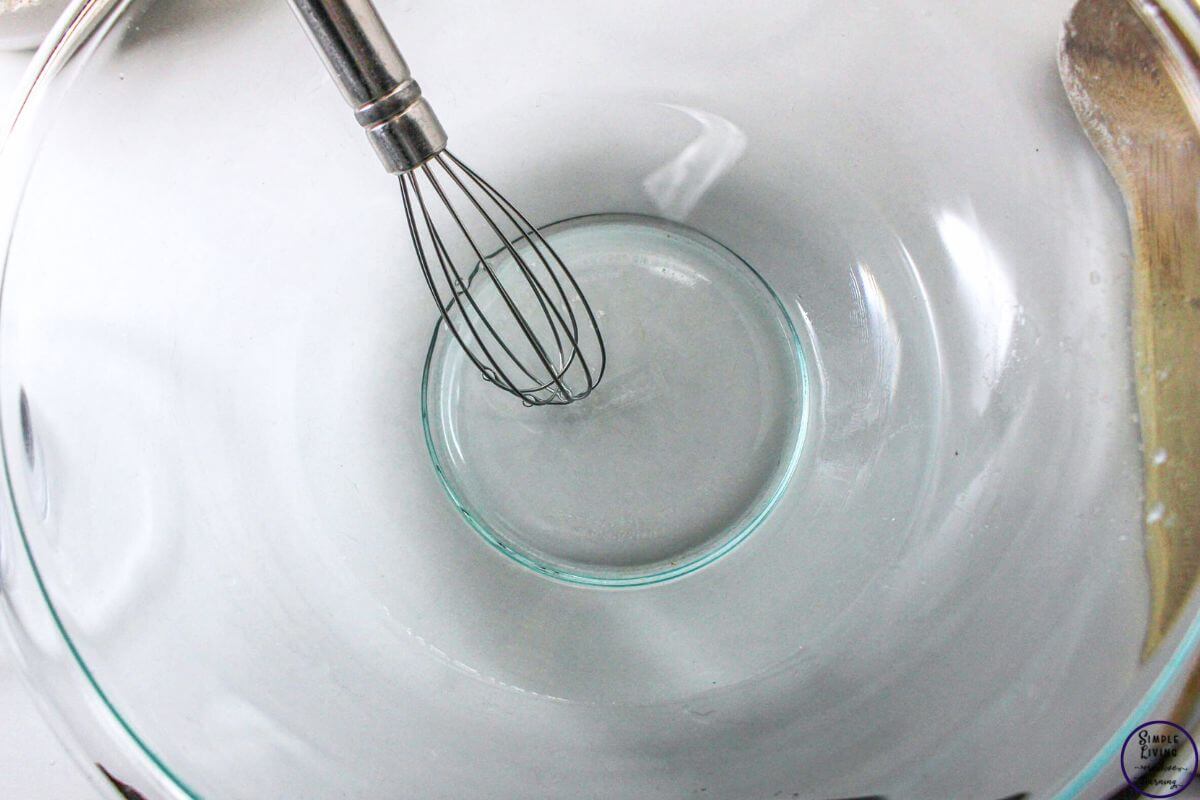 No-Knead Dutch Oven Bread mixing water and sugar