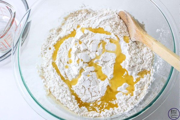 No-Knead Dutch Oven Bread adding flour and oil