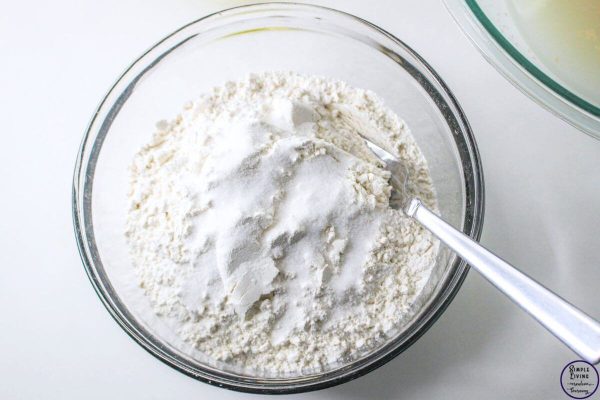 No-Knead Dutch Oven Bread adding the flour and salt to a bowl