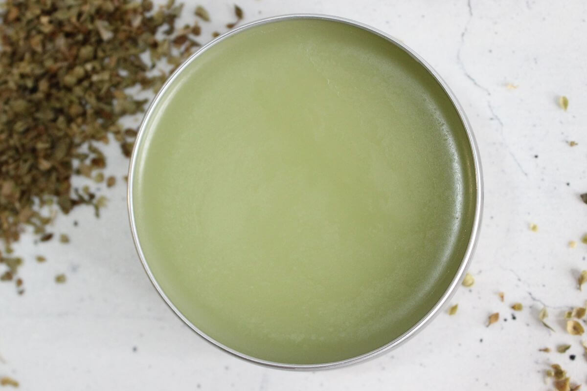 Homemade Oregano Salve looking down on tin