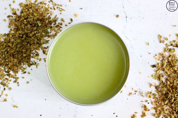 Homemade Oregano Salve in a tin ready to use