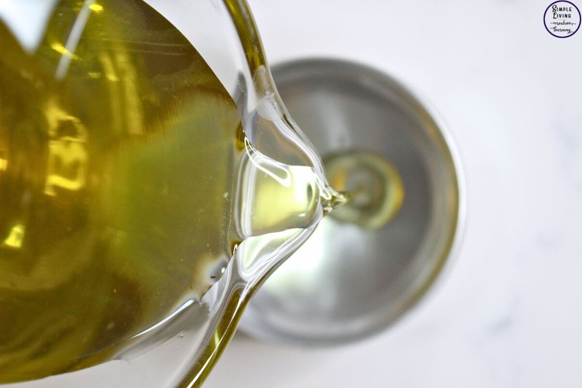 St. John's Wort Salve pouring mixture into containers