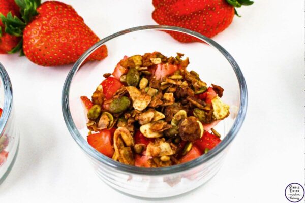 Strawberry Yoghurt Parfaits adding a layer of granola