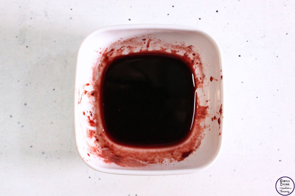 Homemade Beetroot Lip Balm mixing the glycerin and beetroot powder