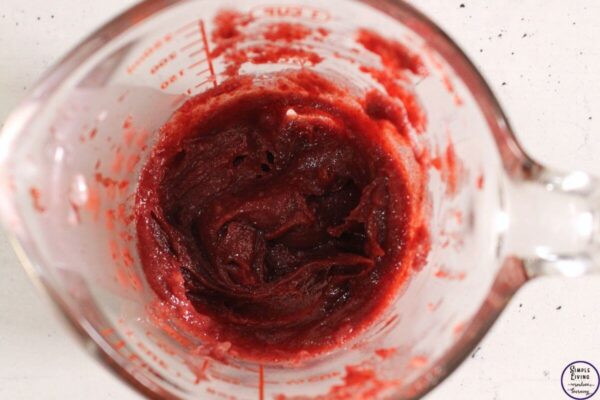 Homemade Beetroot Lip Balm waiting for mixture to cool and stirring it