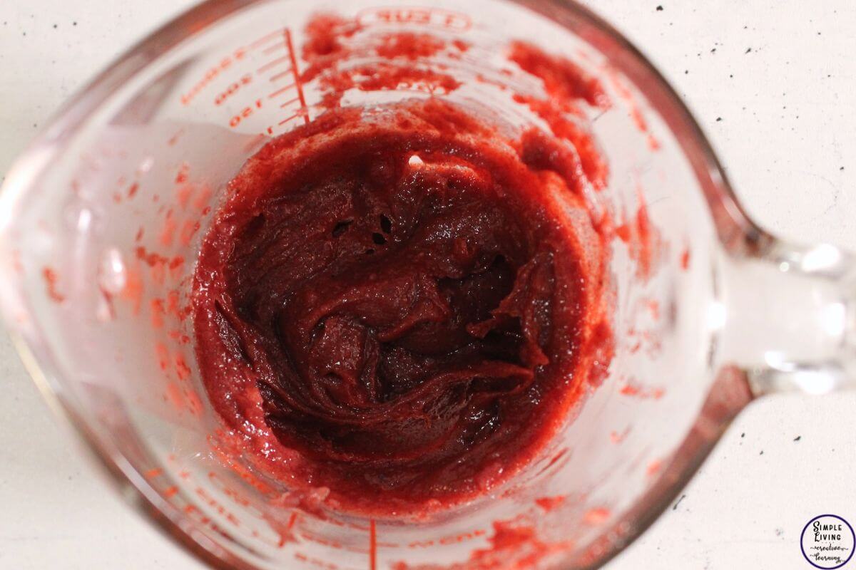 Homemade Beetroot Lip Balm waiting for mixture to cool and stirring it