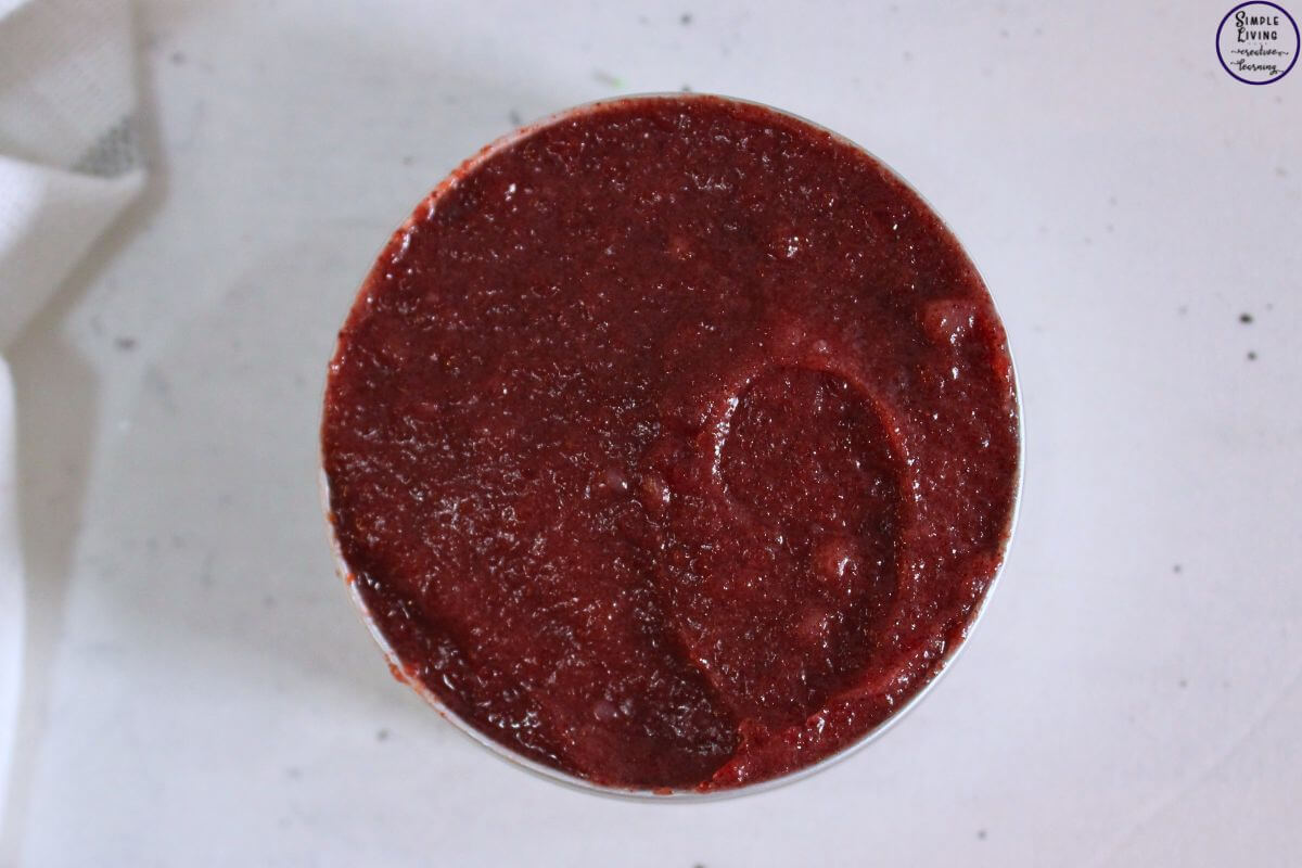 Homemade Beetroot Lip Balm in a tin that is standing on its side