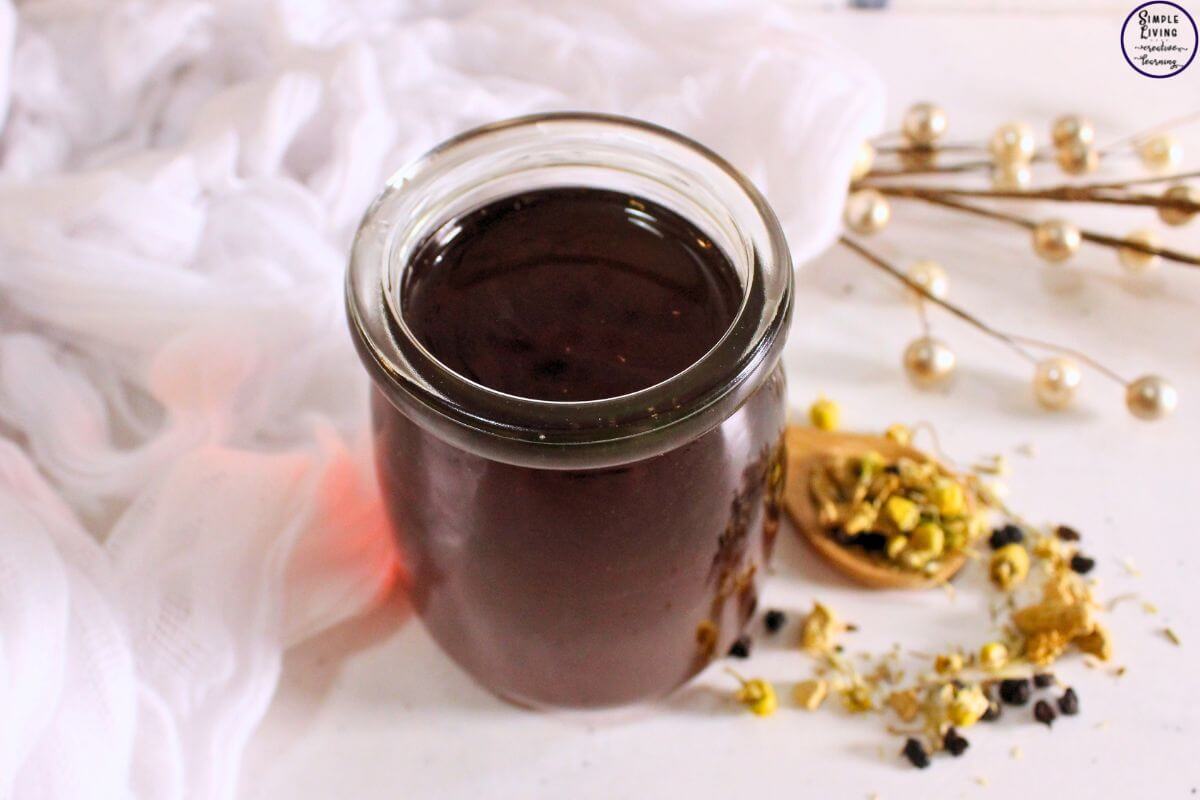 Homemade Cold and Flu Tea in a glass jar ready to drink