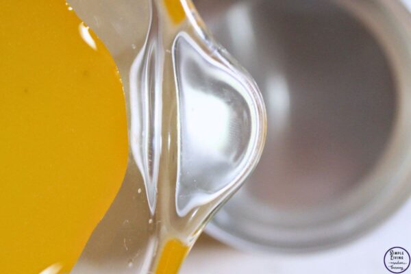 Homemade Frankincense Salve pour into tins