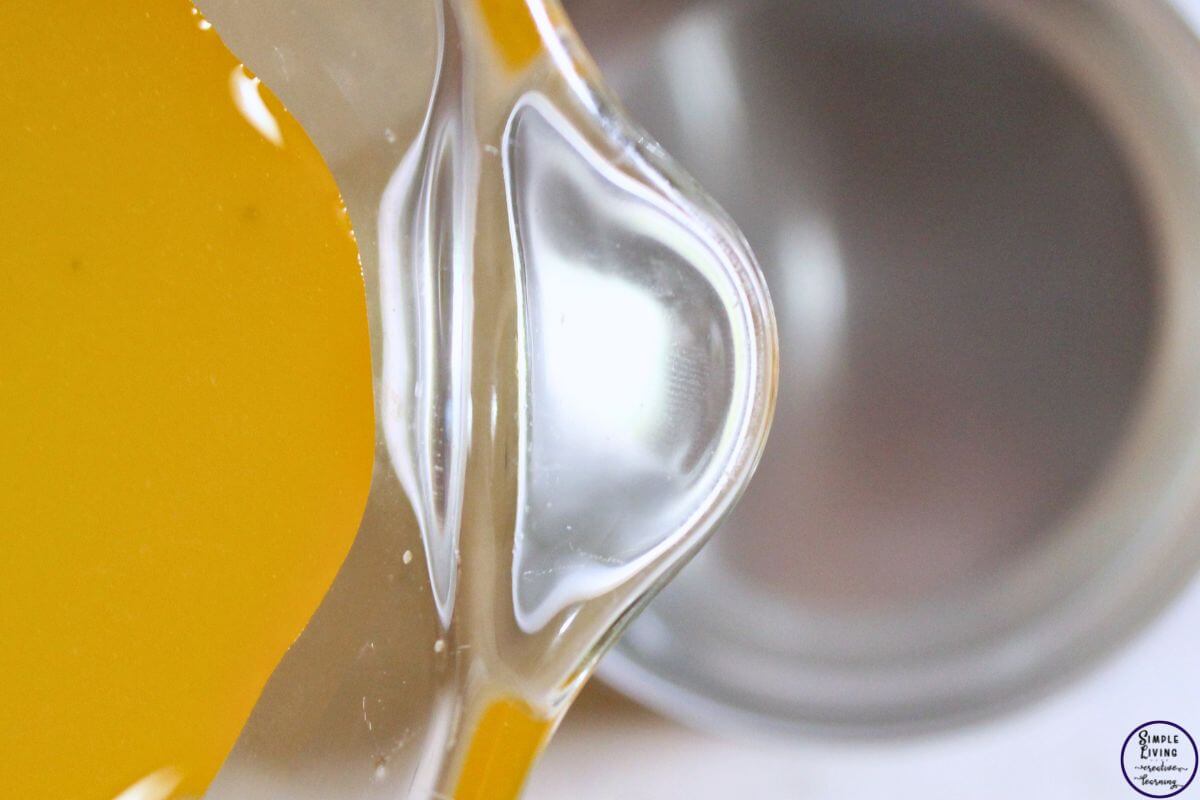 Homemade Frankincense Salve pour into tins