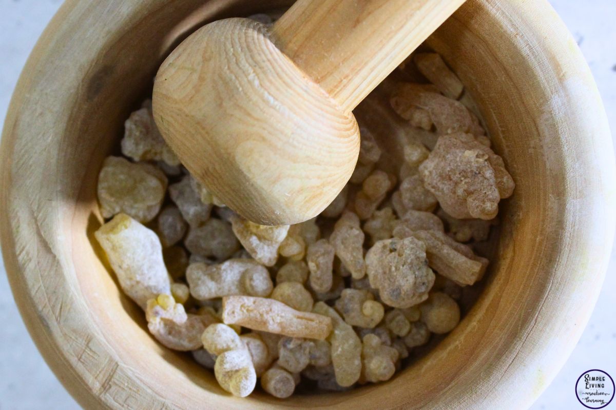 Homemade Frankincense Salve grinding up the Frankincense tears