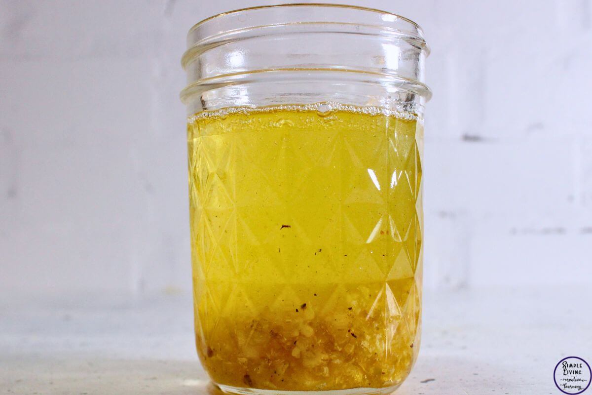 Homemade Frankincense Salve adding carrier oil to Frankincense