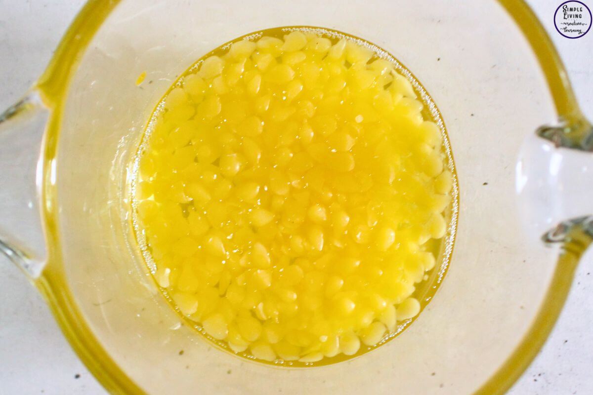 Homemade Frankincense Salve melting beeswax and infused oil