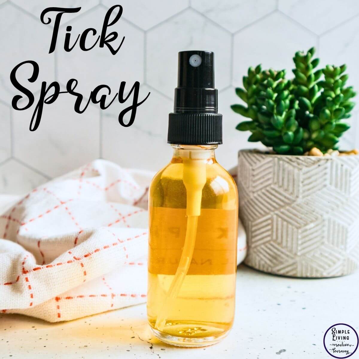 Homemade Tick Spray in a glass bottle