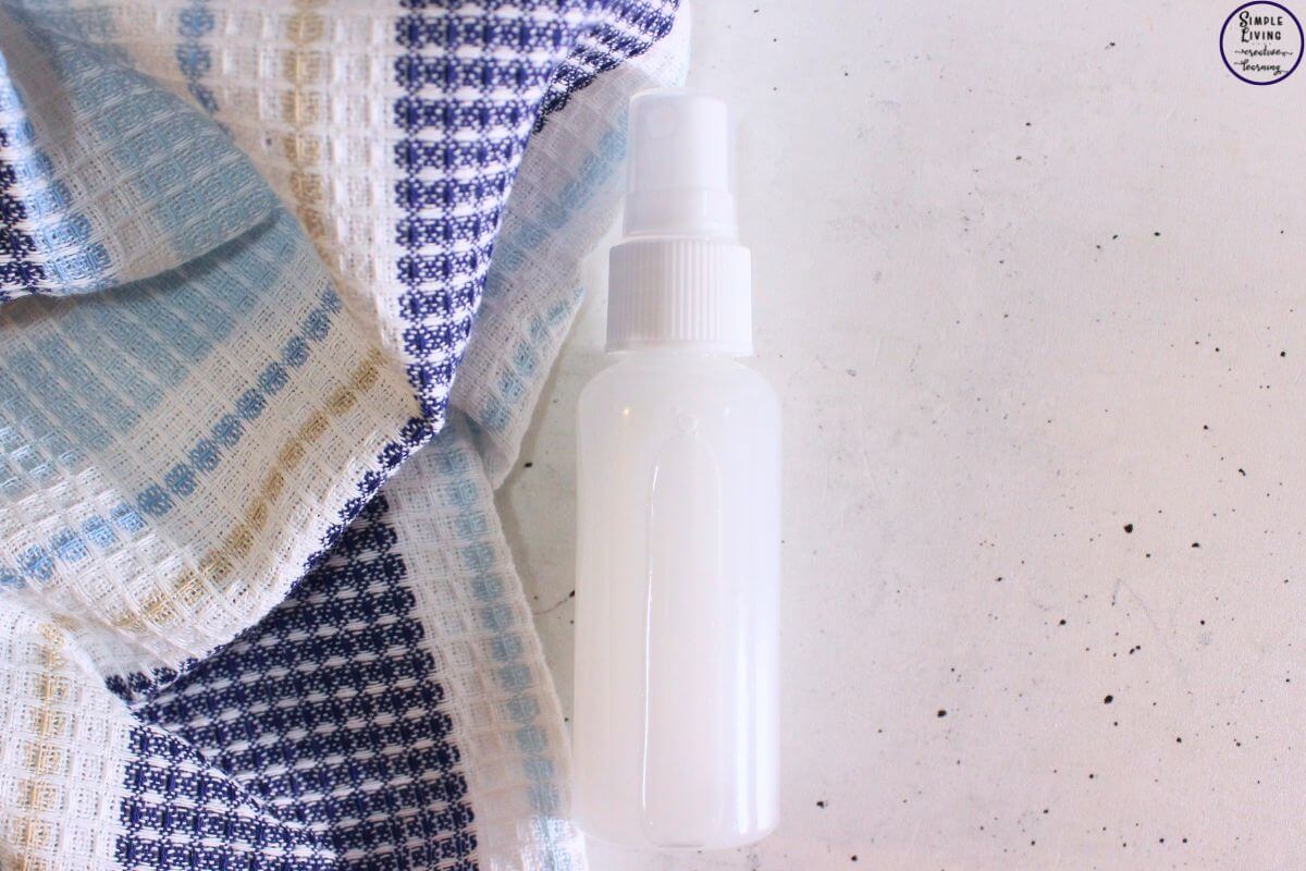 Homemade Anti Itch Spray resting on a bench