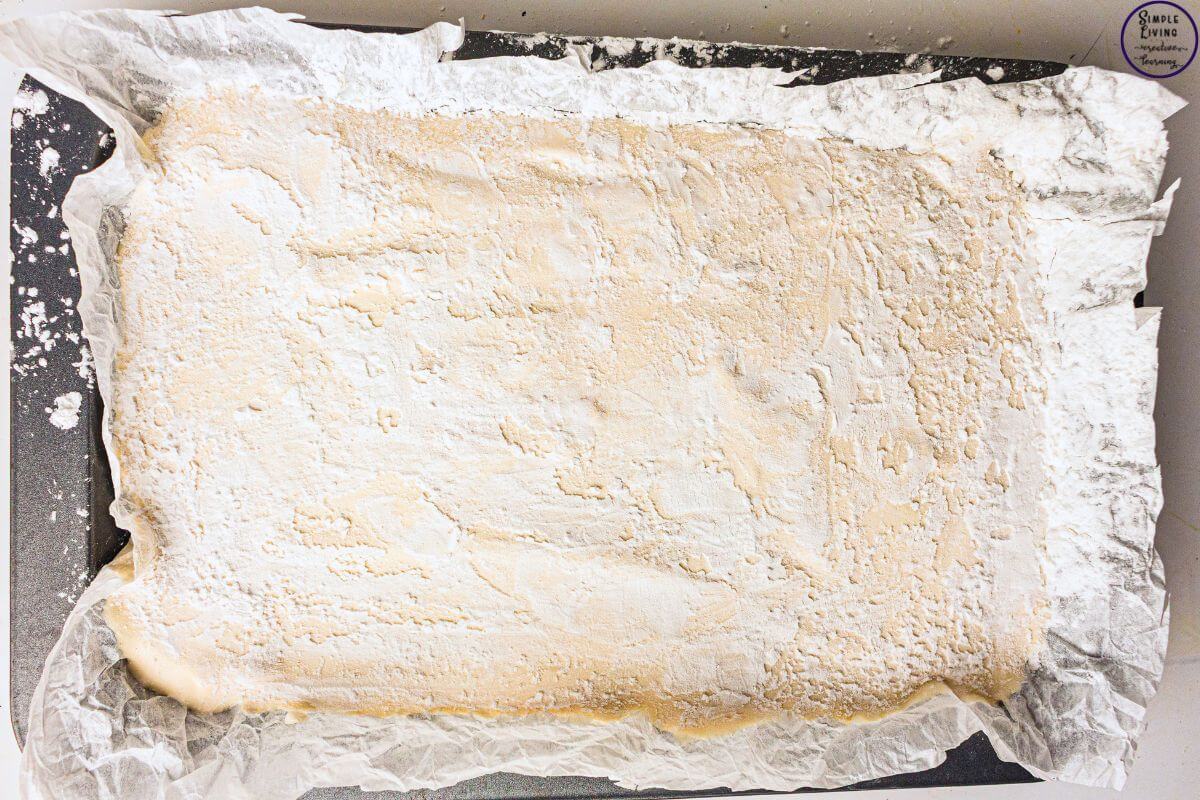 Homemade Vanilla Marshmallows dusting the top of the marshmallow block