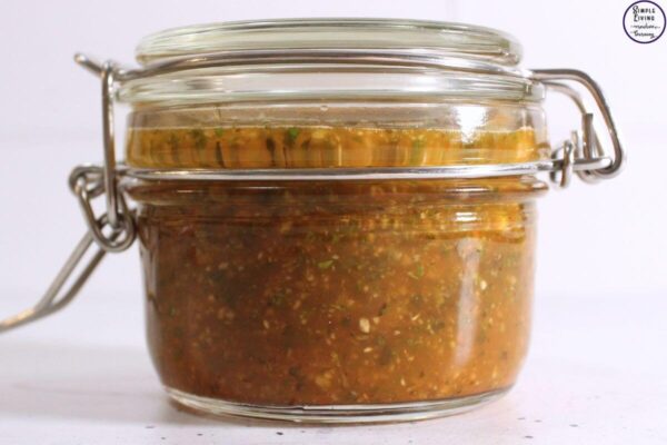 Herbal Garden Pest Spray infusing in a jar