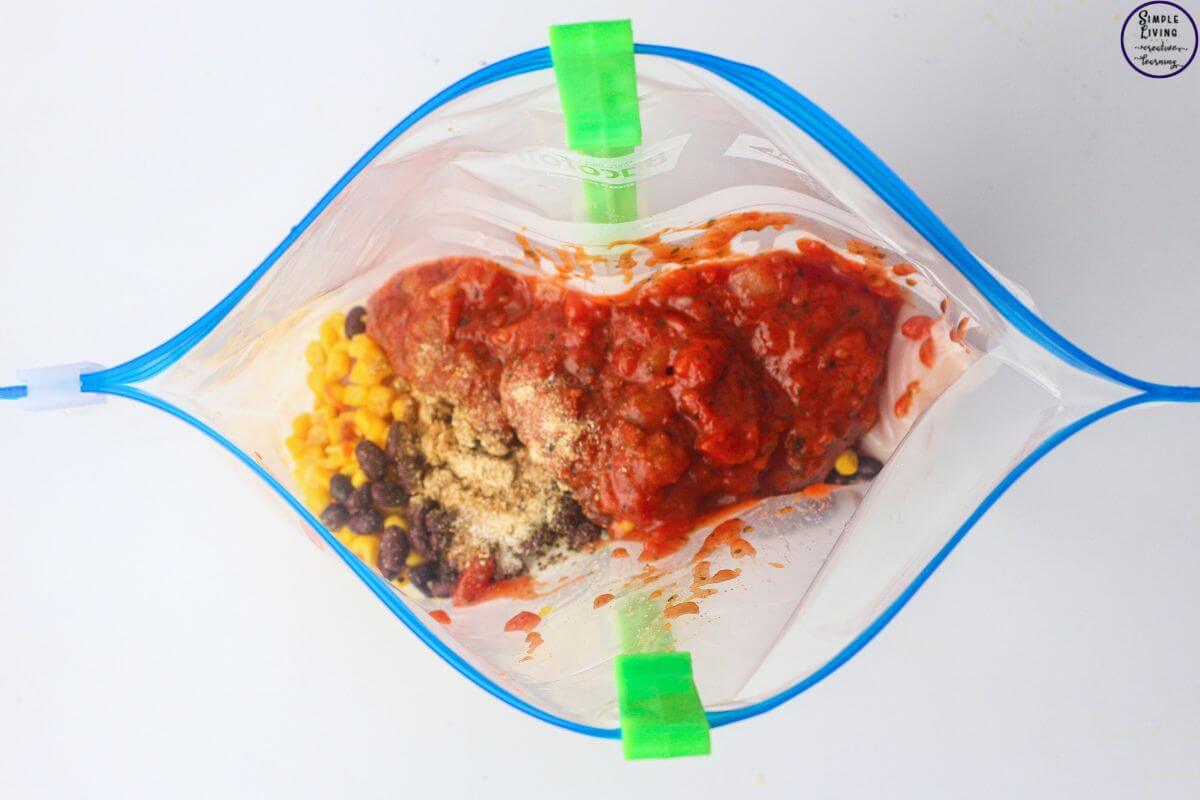 Slow Cooker Salsa Chicken {Dump & Go Freezer Meal} adding ingredients into bag