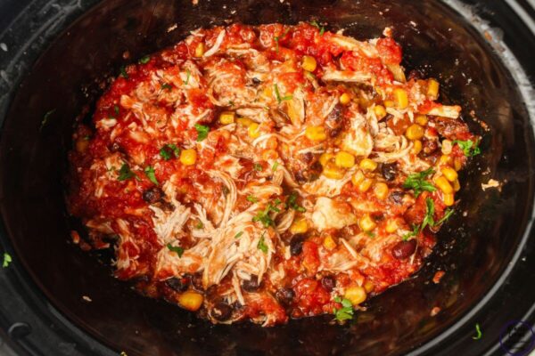 Slow Cooker Salsa Chicken {Dump & Go Freezer Meal} shredding the chicken