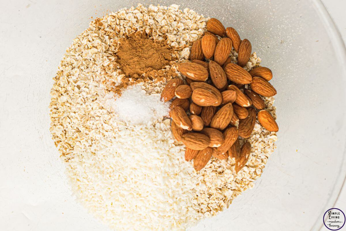 Homemade Granola Recipe adding dry ingredients to a bowl