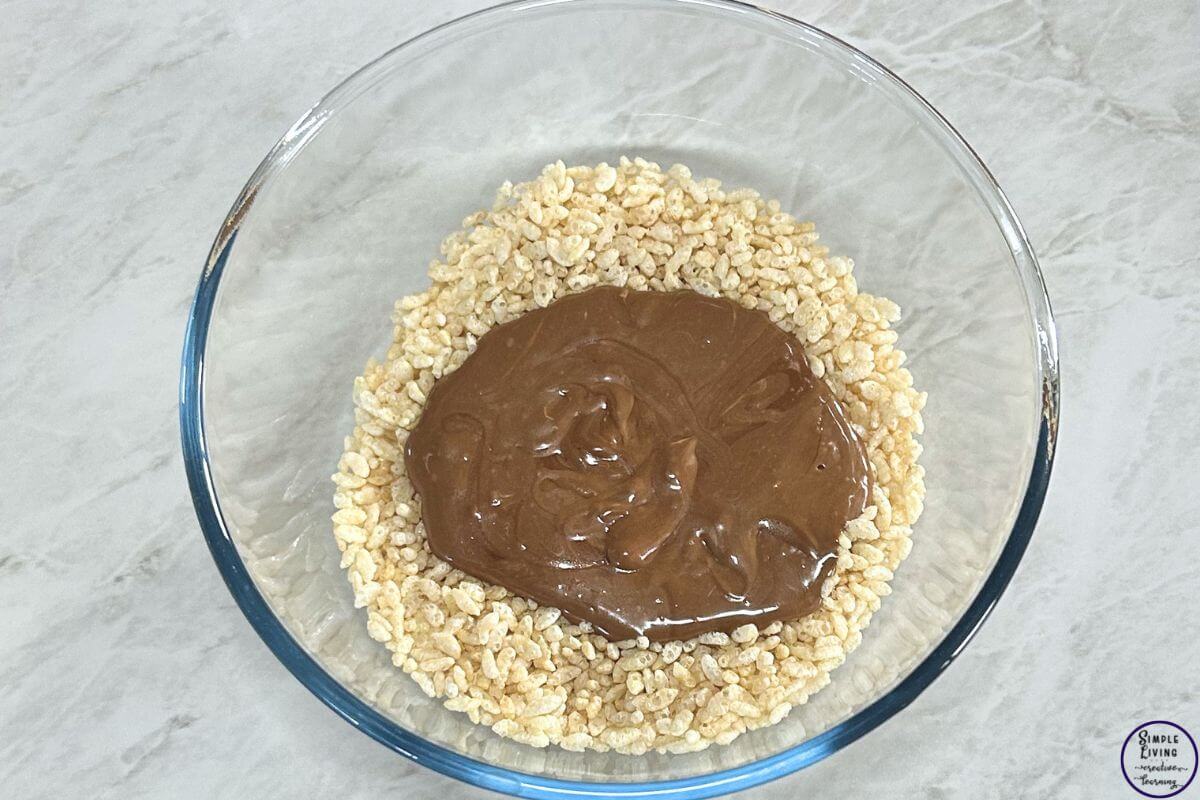 Mars Bar Slice adding Rice Bubbles