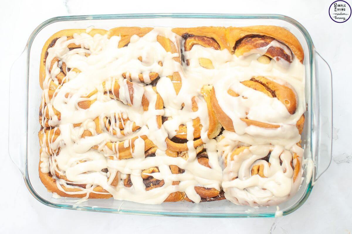 Overnight Sourdough Cinnamon Rolls Recipe drizzle glaze over rolls